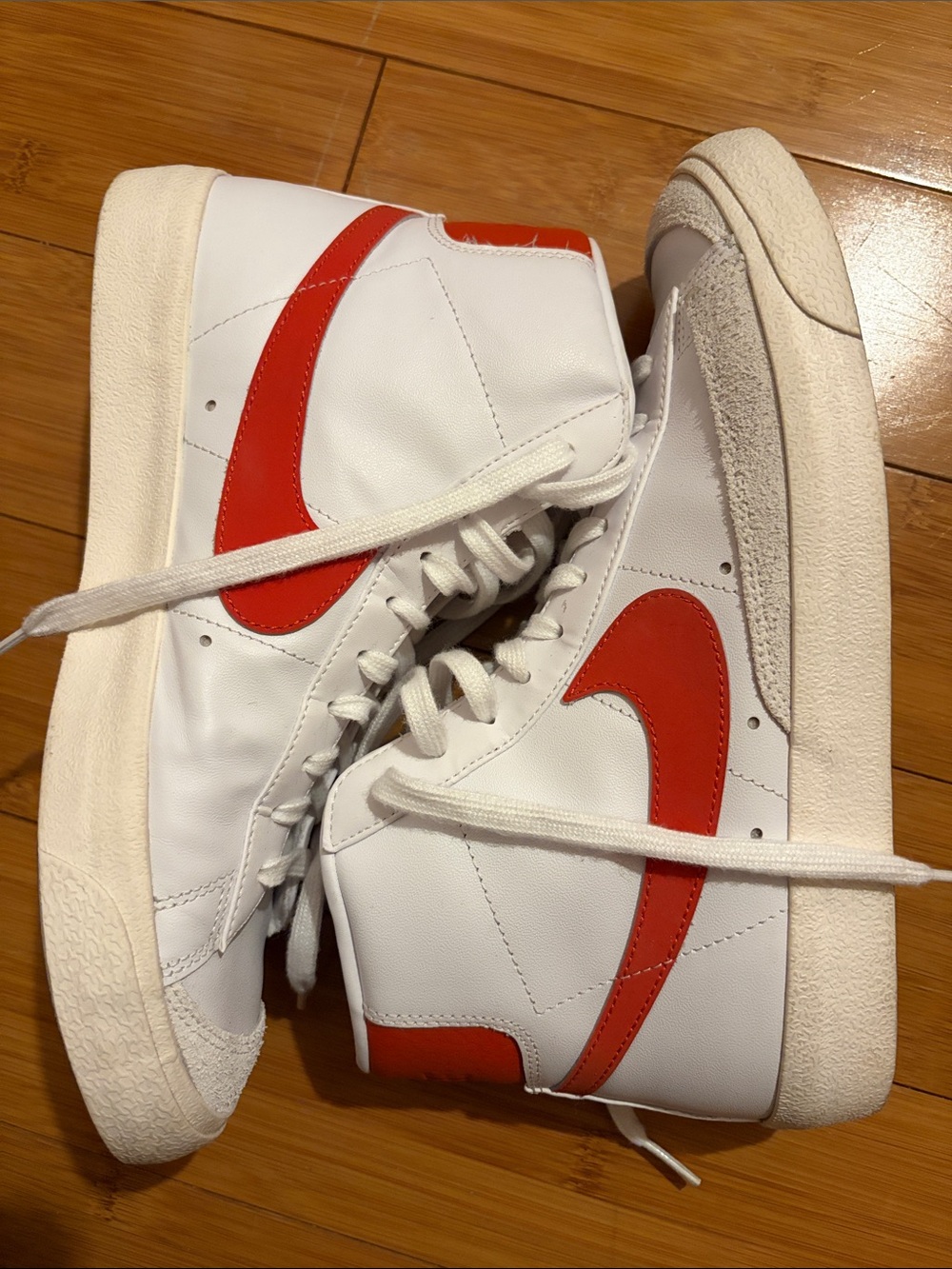 Nike Kids High-Top Sneakers in White with Red Swoosh